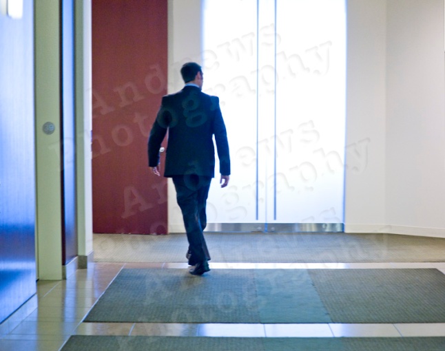 stock photos man walking in halway